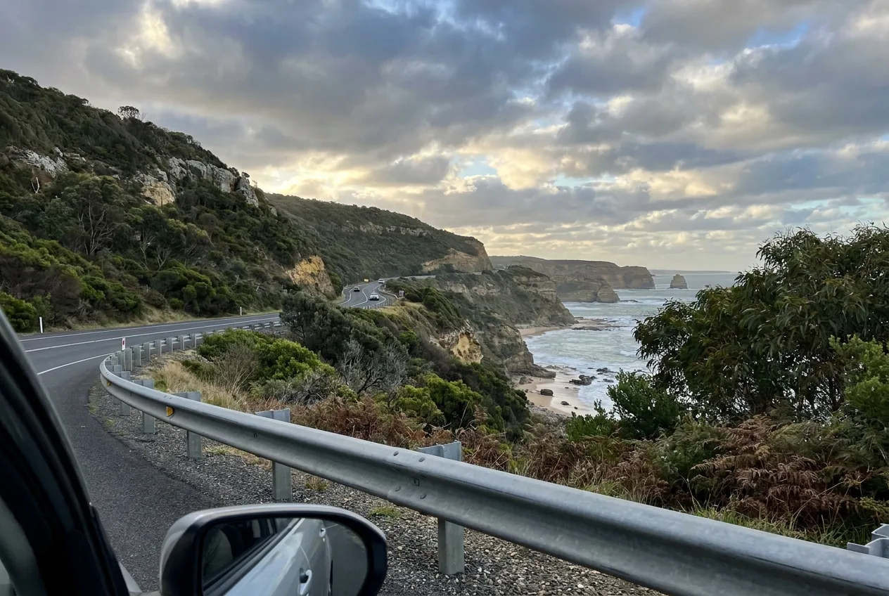 Great Ocean Road winding along Victorian limestone sea cliffs with Southern Ocean below